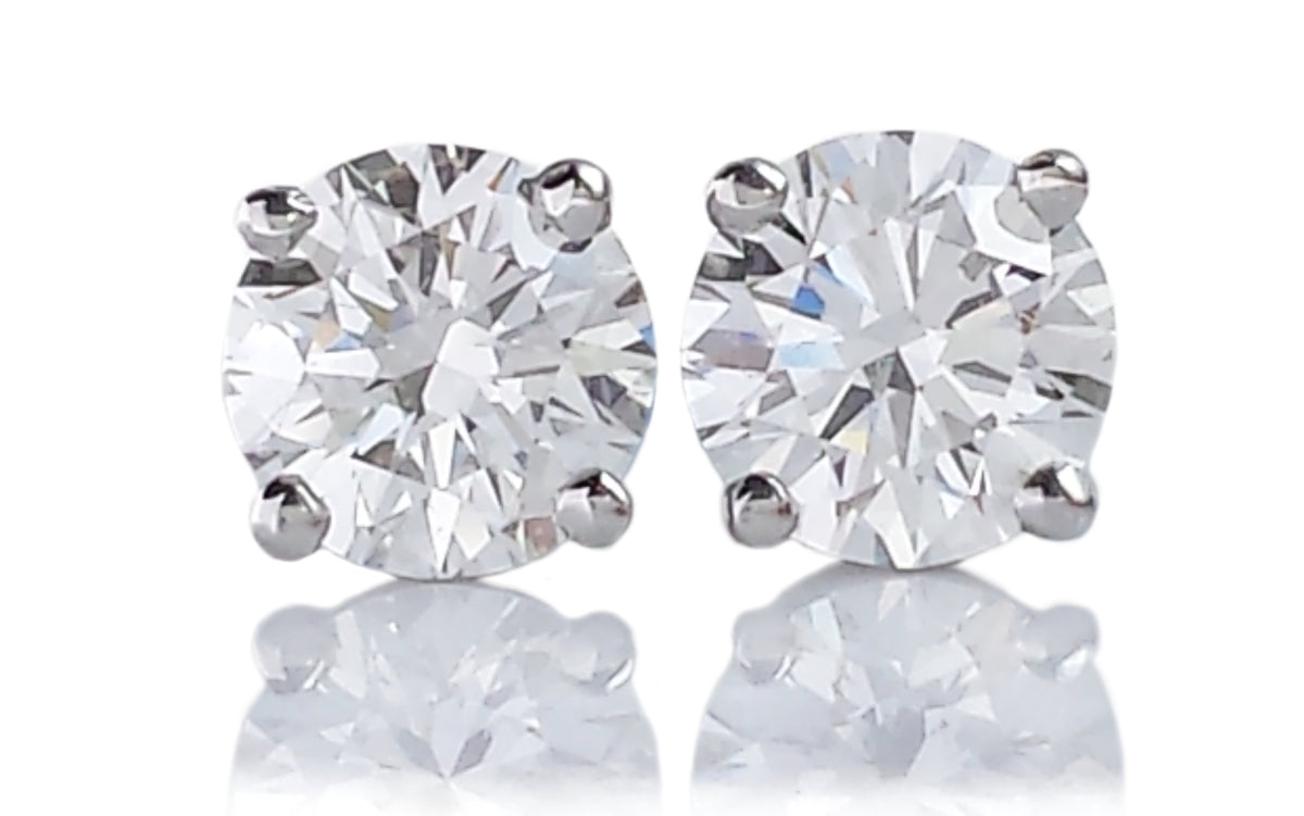 Tiffany & Co. 0.60tcw E/F/VS1 Round Brilliant Diamond Stud Earrings.