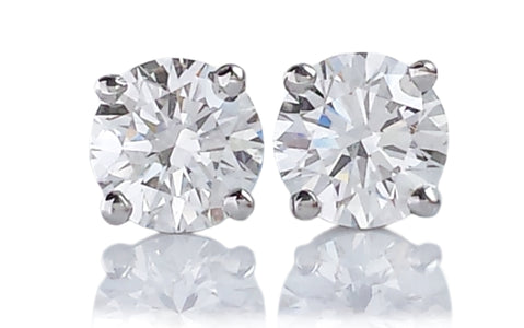Tiffany & Co. 0.60tcw E/F/VS1 Round Brilliant Diamond Stud Earrings.