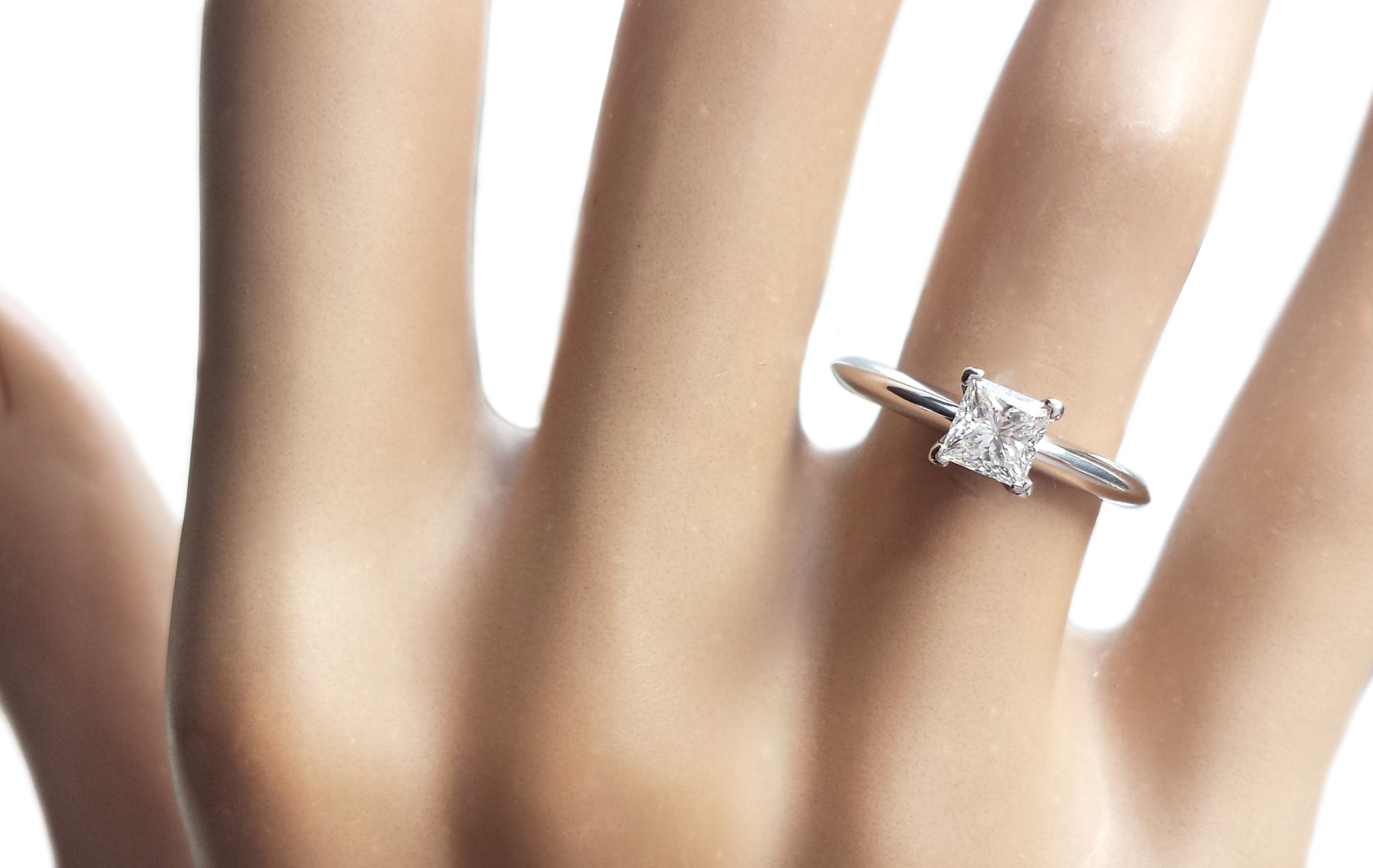 Tiffany & Co. 0.45ct E/VS1 Princess Cut Diamond Engagement Ring on model's finger