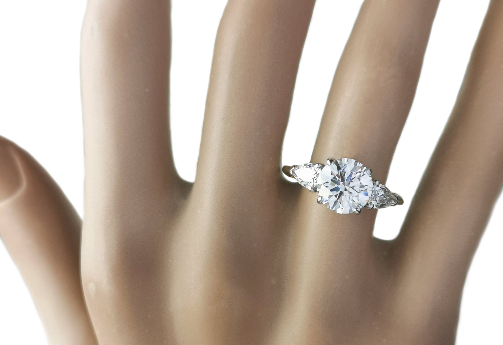 Tiffany & Co. 2.75tcw F/VS1 Three Stone Diamond Engagement Ring with Pear-shaped side stones on model hand