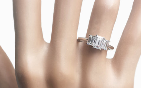 Tiffany & Co. 1.39tcw E/F/VVS2 3-Stone Emerald Cut Diamond Engagement Ring on finger