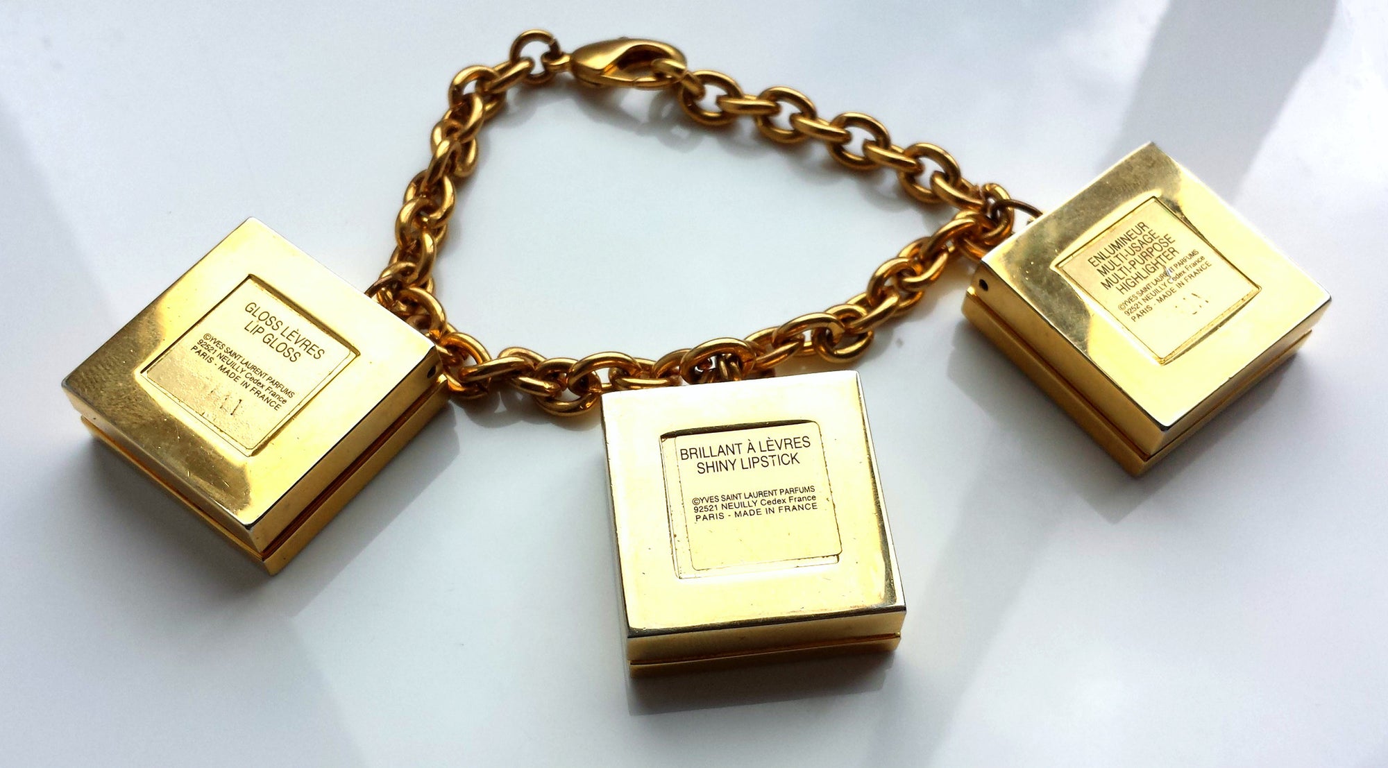 Vintage YSL Yves Saint Laurent Gold Tone Limited Edition Bracelet with Lip Gloss