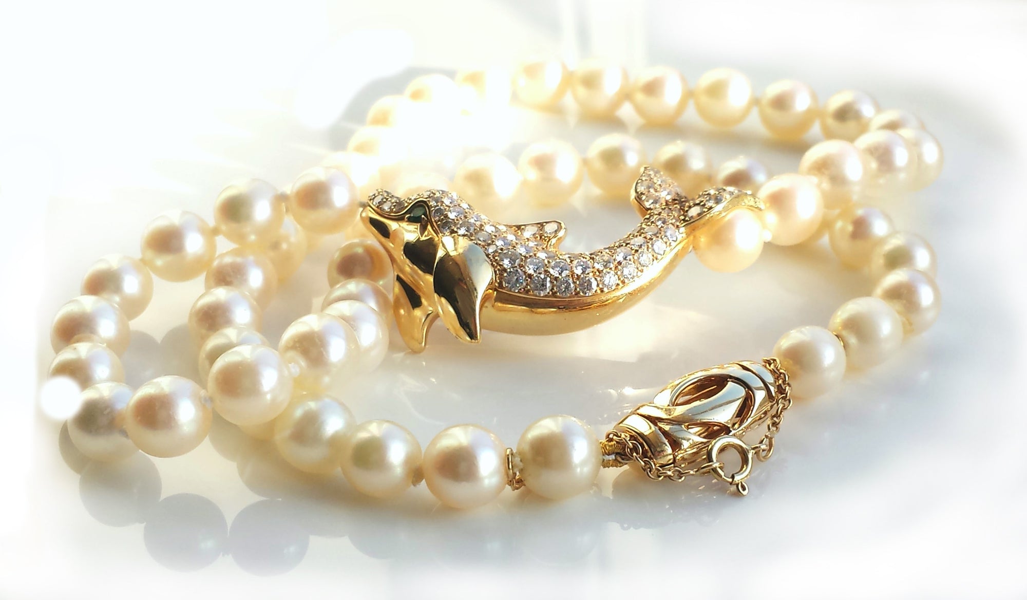Cartier Akoya Pearl Dolphin Necklace in 18K Gold set with Diamonds & Emerald