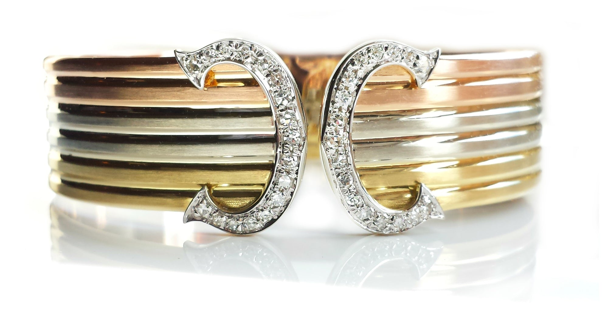 Cartier Double C 'de Cartier' Decor Trinity Bracelet in 18K gold & diamond setting