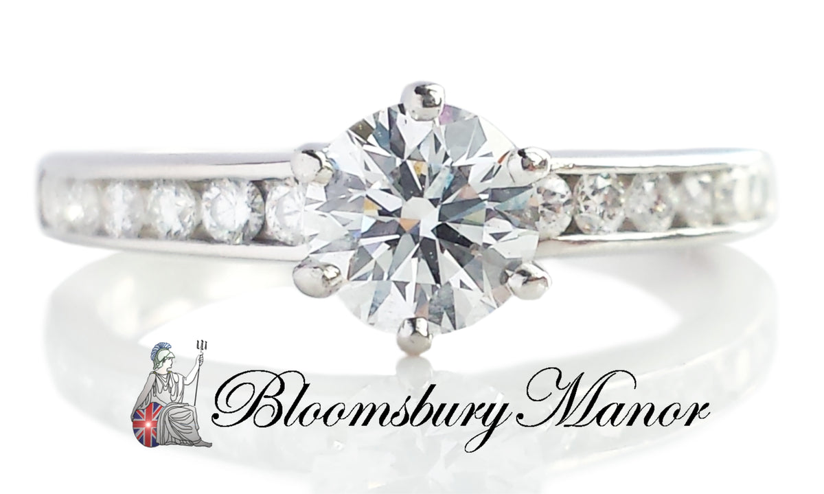 Tiffany & Co .76ct D/VS2 Round Brilliant Diamond Ring with Side Stones