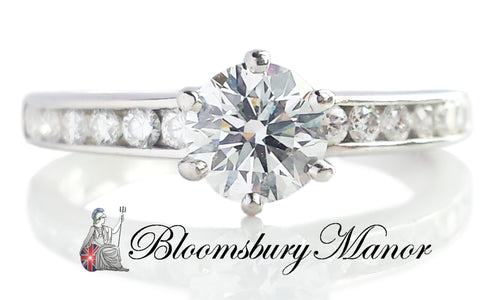 Tiffany & Co .76ct D/VS2 Round Brilliant Diamond Ring with Side Stones