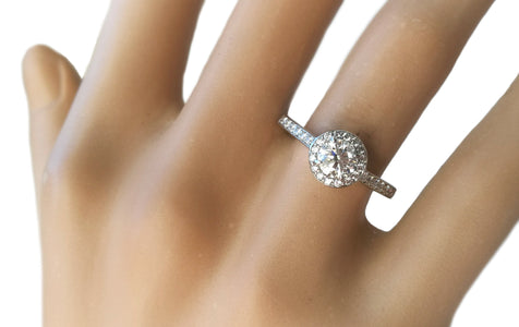 Tiffany & Co. 0.70tcw I/IF Triple-X Embrace Diamond Engagement Ring on finger